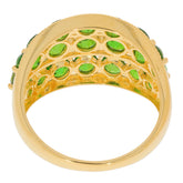 Close-up view of the interior of a gold ring decorated with round green chrome diopside gemstones.